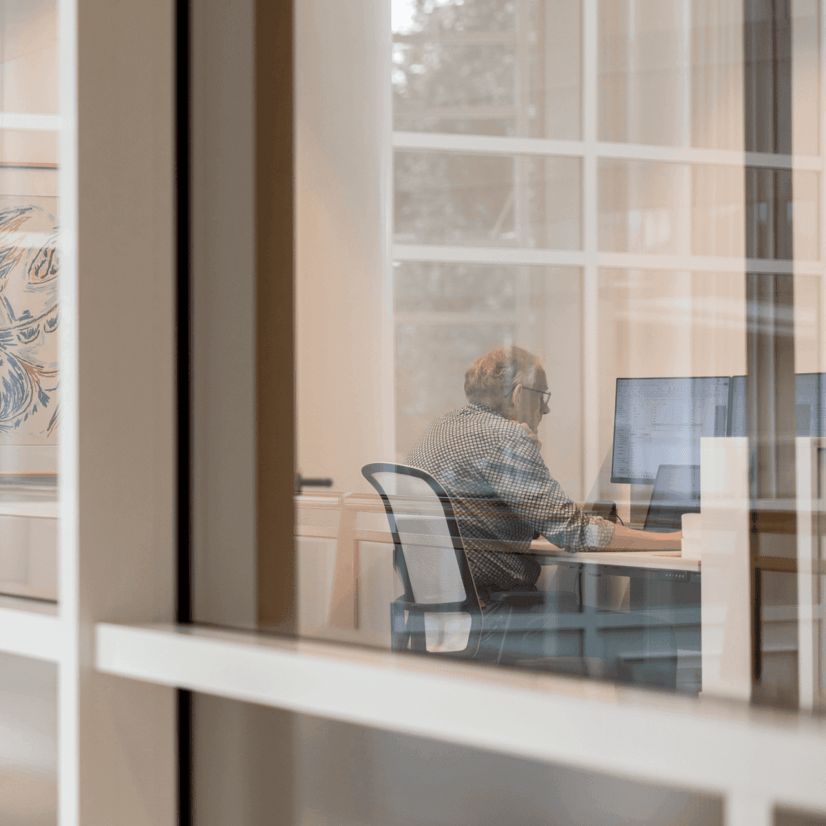 Employee working computer office space
